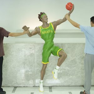 Modern Brazilian basketball player dunking sculpture